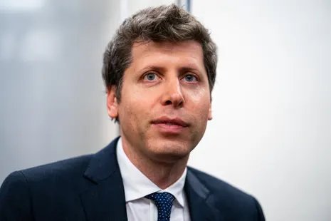 A man in a suit looks ahead