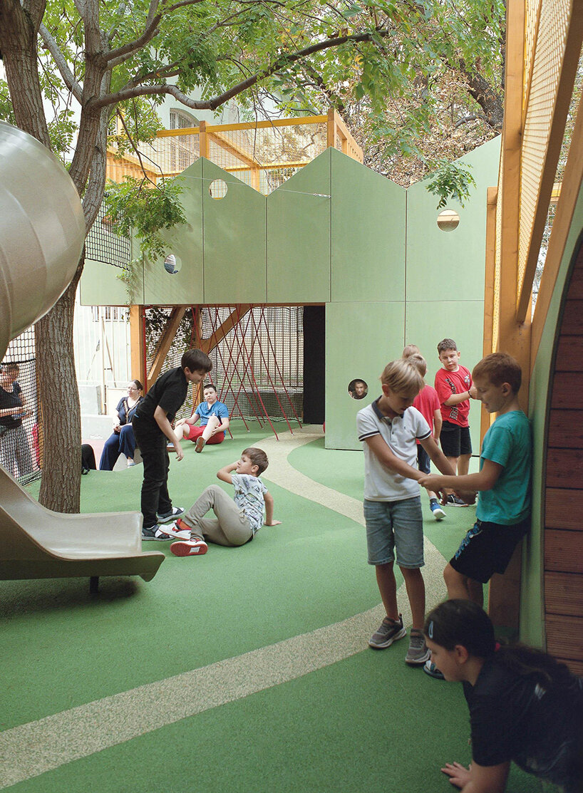 studio KRAFT reclaims limited schoolyard space with vertical play garden in budapest - 3