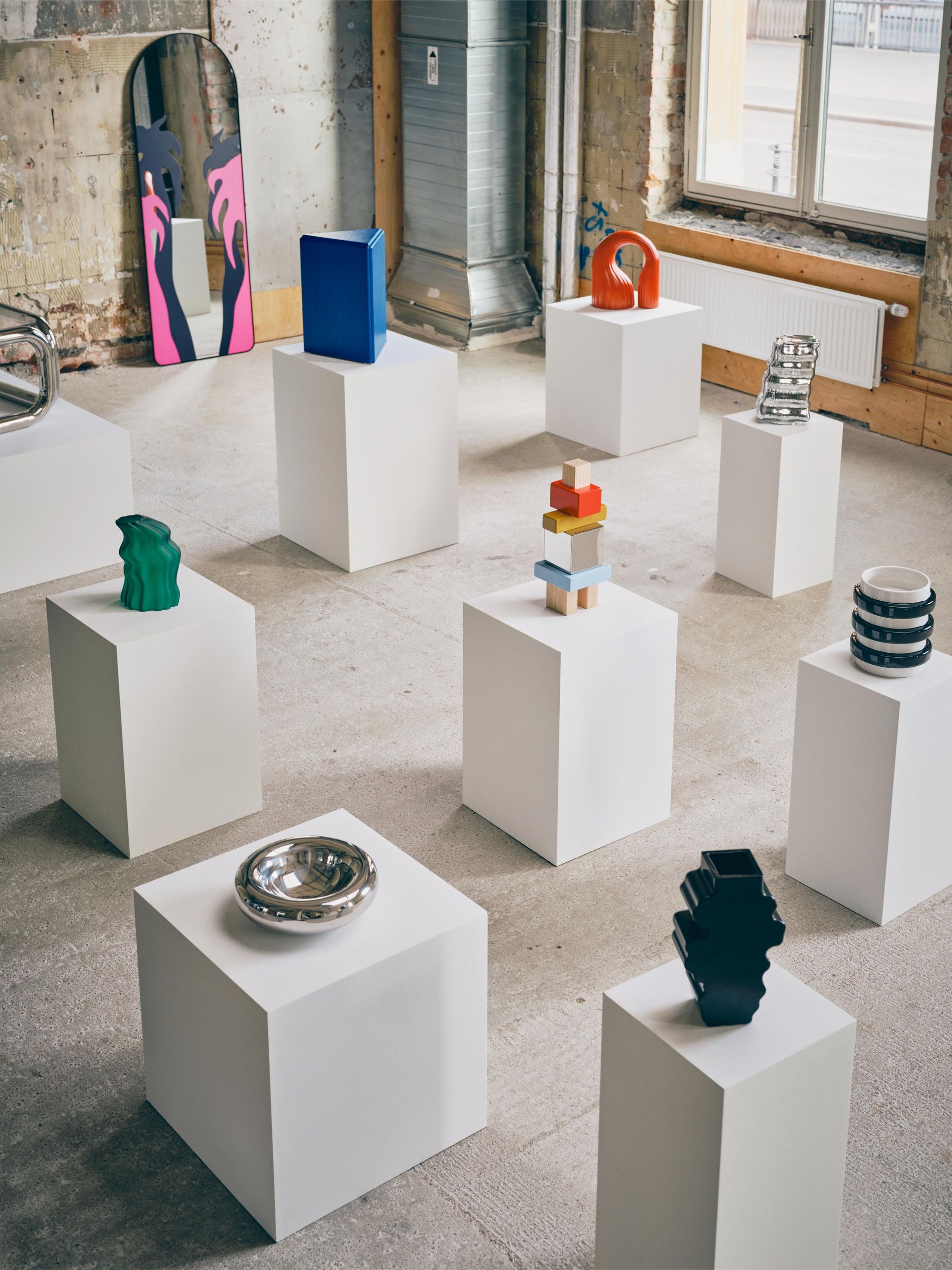 furniture and objects displayed on plinths