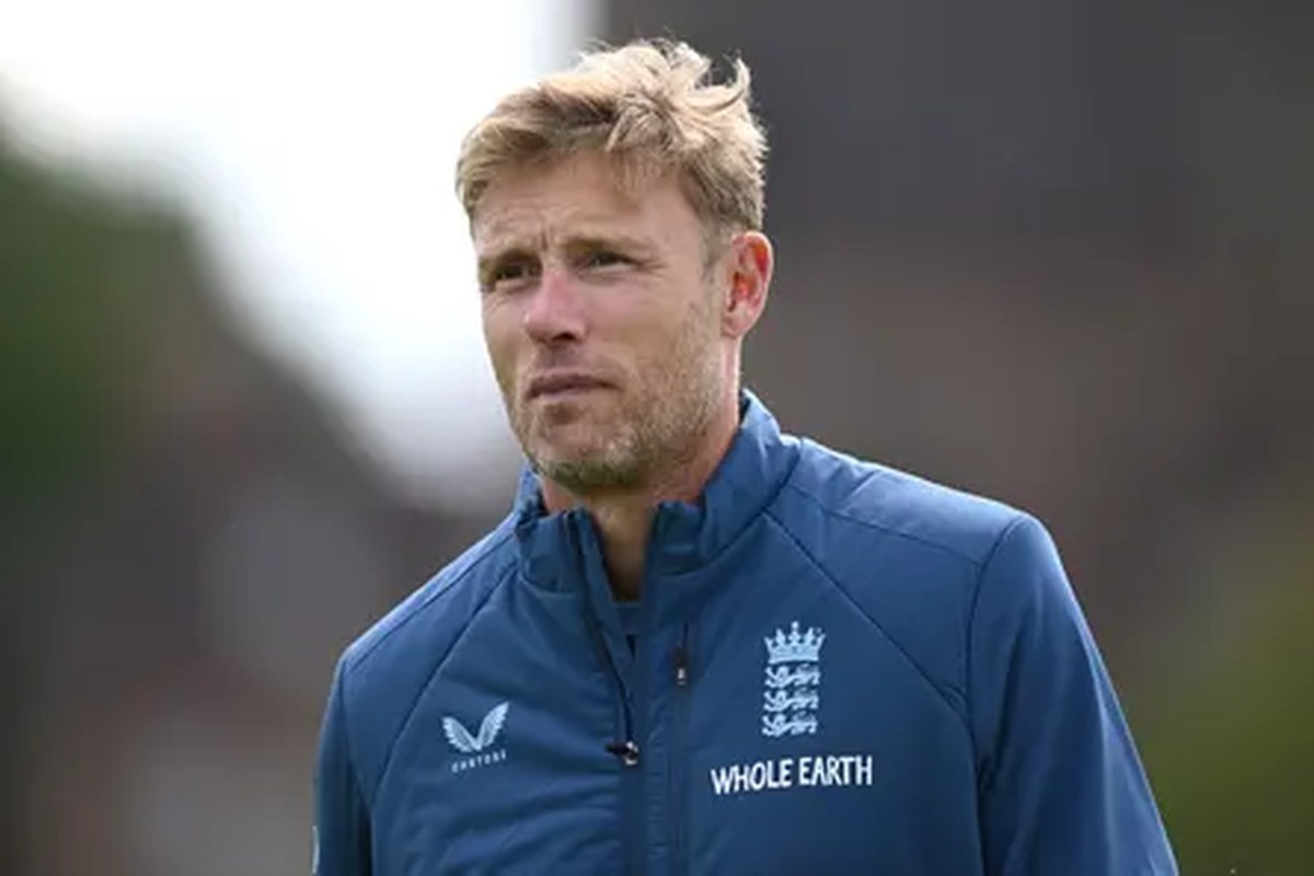 Andrew Flintoff in blue cricket sports gear outside