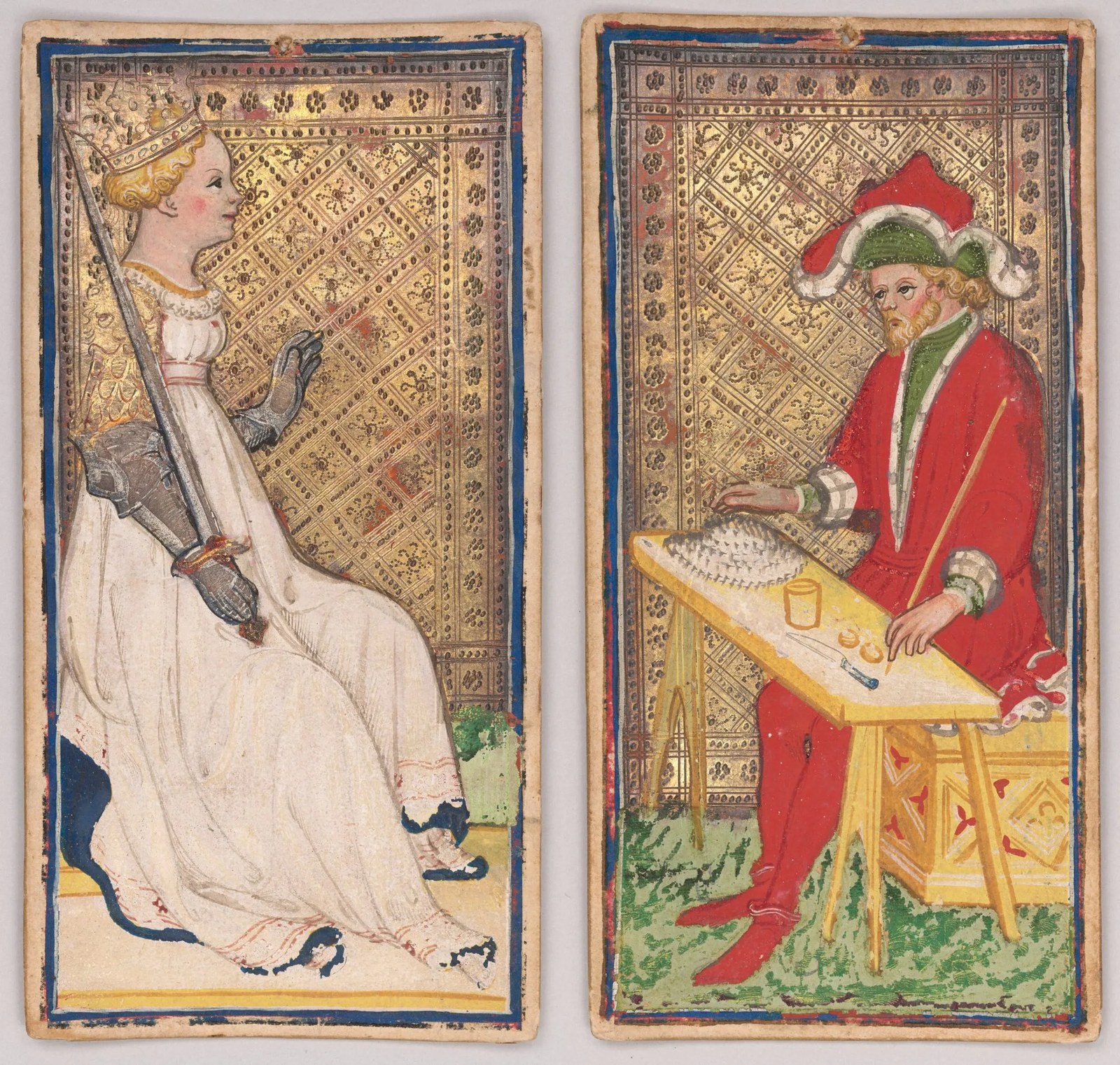 Two hand-painted Tarot cards from the Visconti-Sforza deck, side by side against a gold, patterned background. The left card shows a crowned woman in a flowing white gown, seated and wearing an armored gauntlet, holding an upright sword propped against her shoulder — likely a personification of Justice or Fortitude. The right card depicts a bearded man in a red robe trimmed with green, wearing an elaborate scalloped hat with white and green folds, seated at a slanted yellow table or workbench with tools, coins, and a small object resembling a fish or comb laid out before him, possibly representing a craftsman or the figure of the World or a similar allegorical trade scene. Both figures sit against ornately stamped gold backgrounds bordered in blue. Painted by Bonifacio Bembo, circa 1456–58; held by the Morgan Library & Museum.
