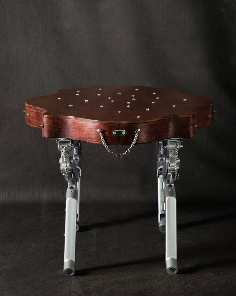 19th-century coffee table gets articulated computer arms to take on a canine form - 1