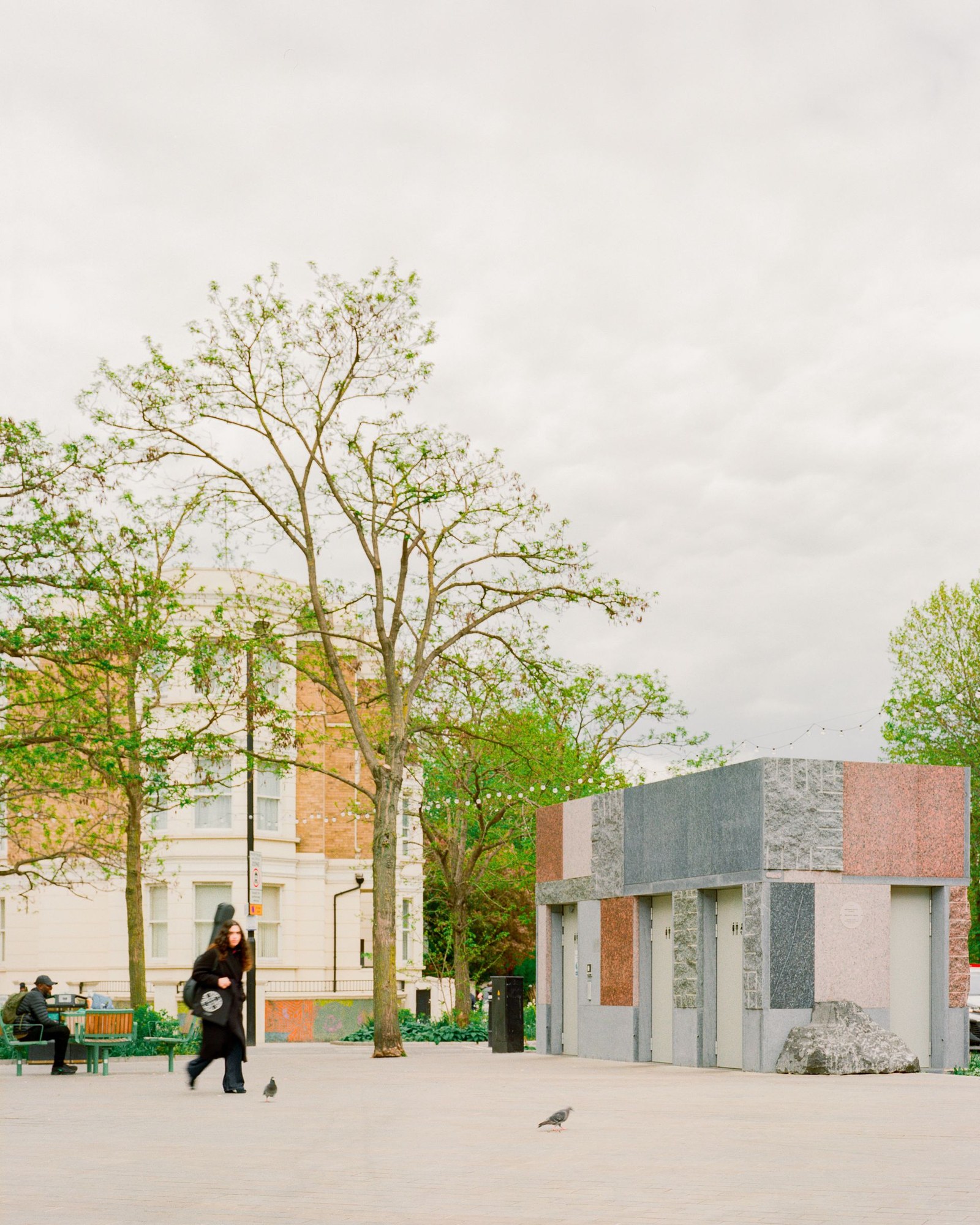 exterior view of Maida Vale public toilet by Studio Weave made out of reclaimed stone, looking like square patchwork