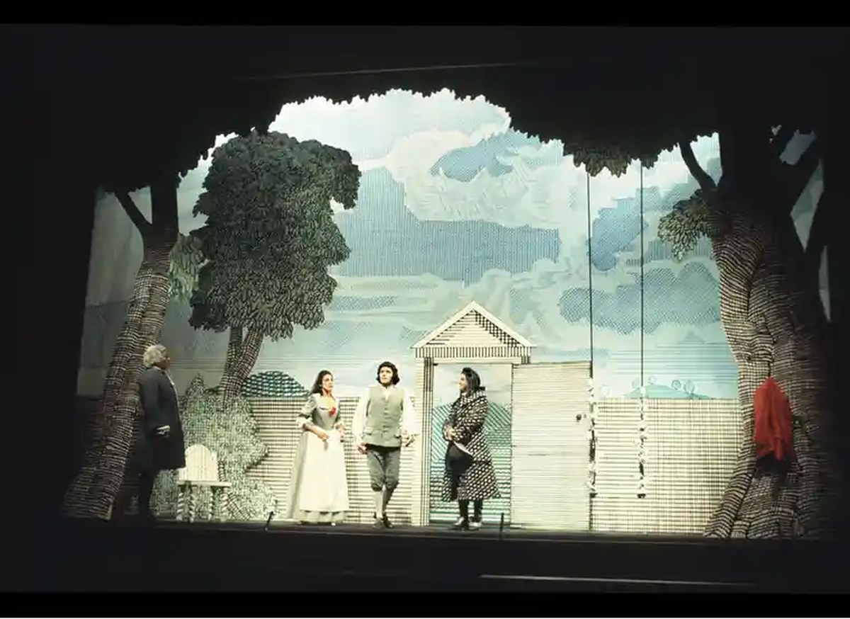 A scene from the opera, set in a garden