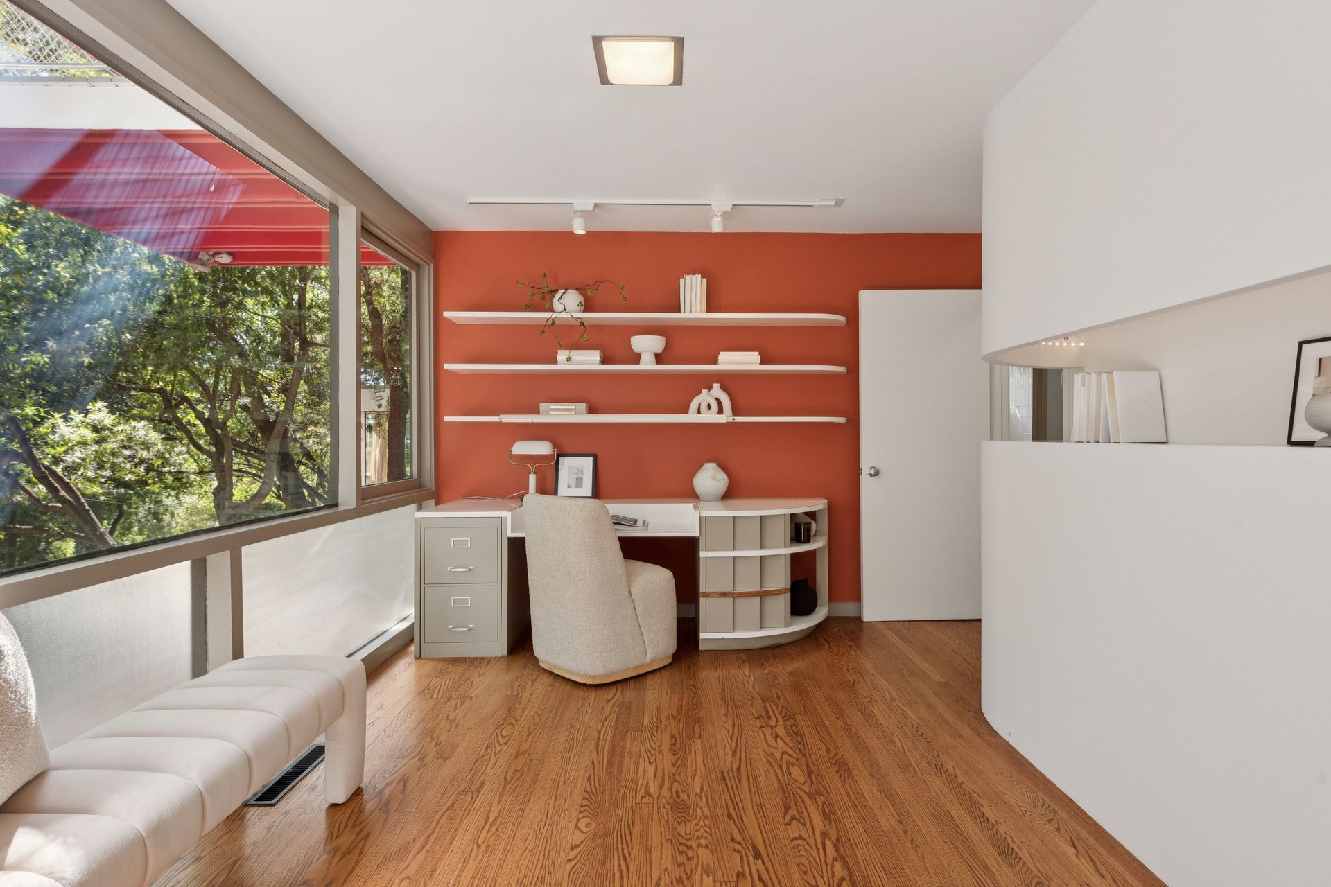 A bedroom and dressing area at the front of the house