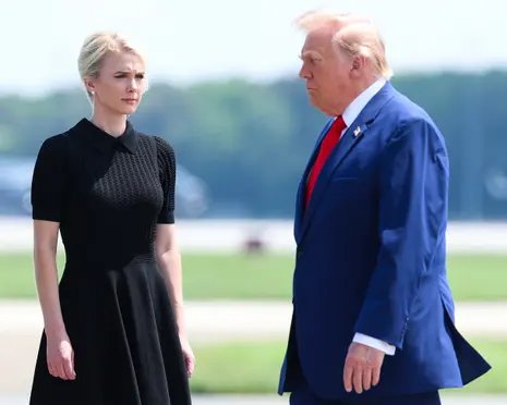 a woman and a man stand outside