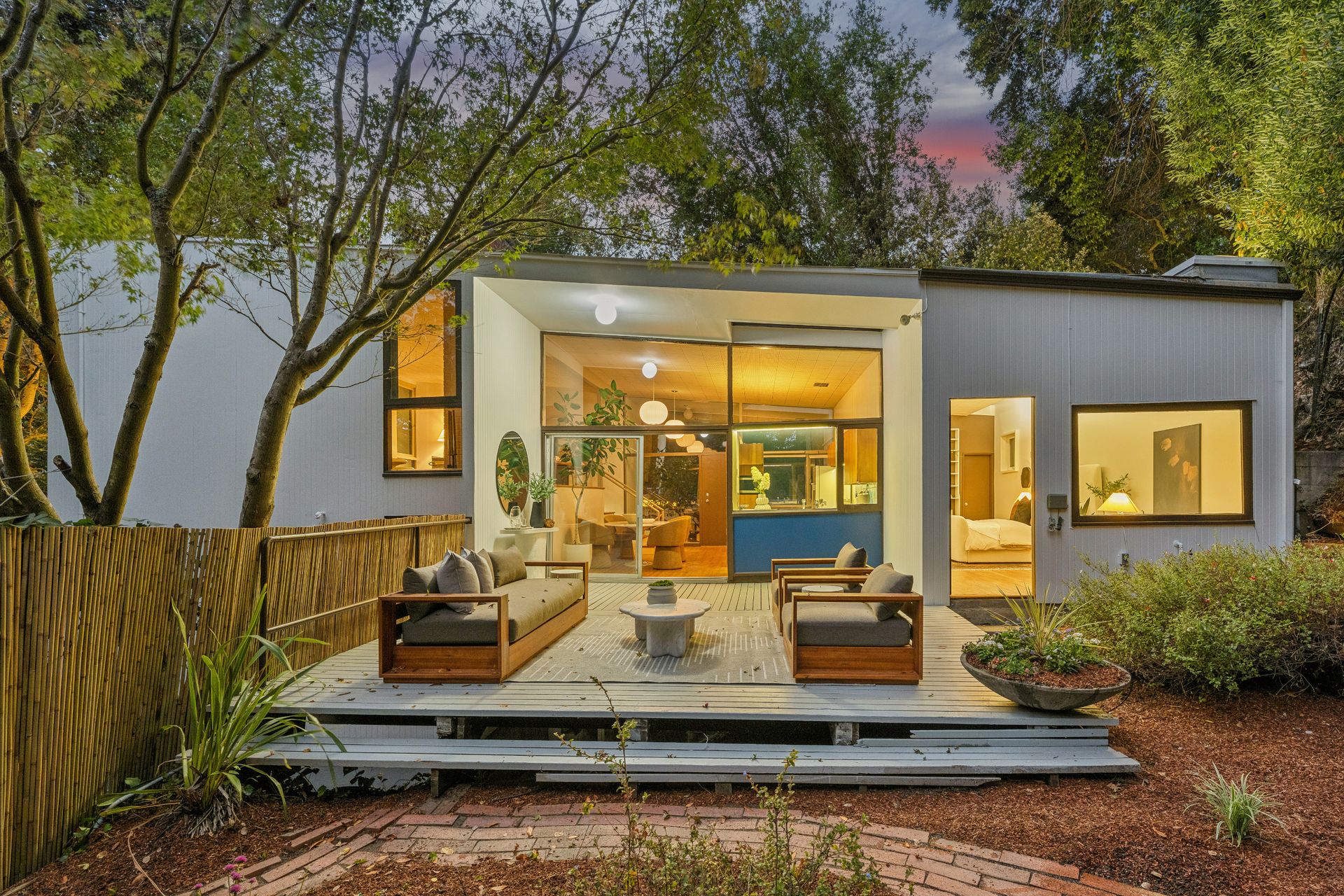 The upper floor has direct access to the deck and the yard