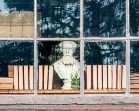 A bust of Charles Dickens looks out of a window of the Dickens House Museum in Broadstairs