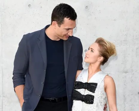 a man and a woman look at each other