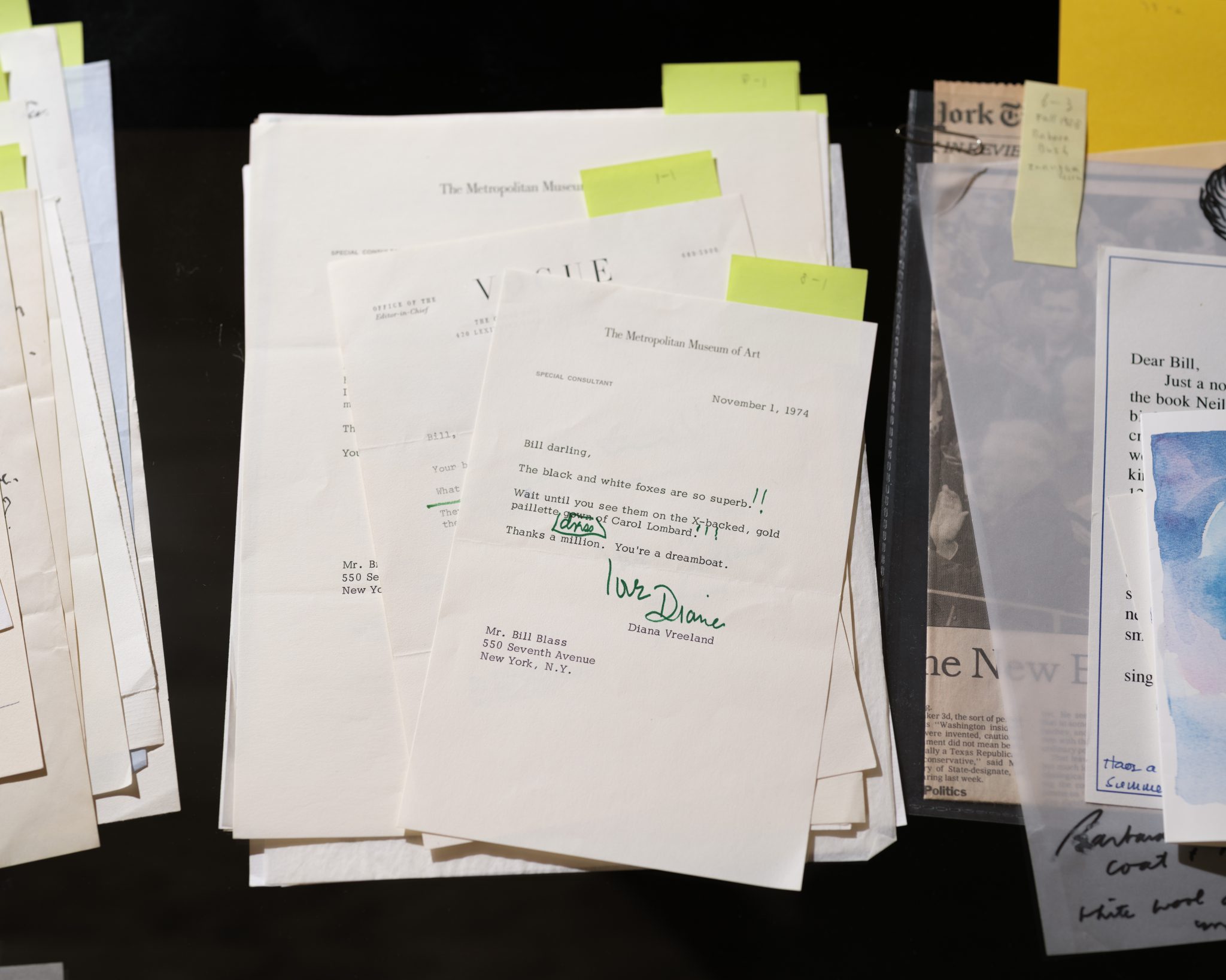 A photograph depicting stacks of letters against a black background