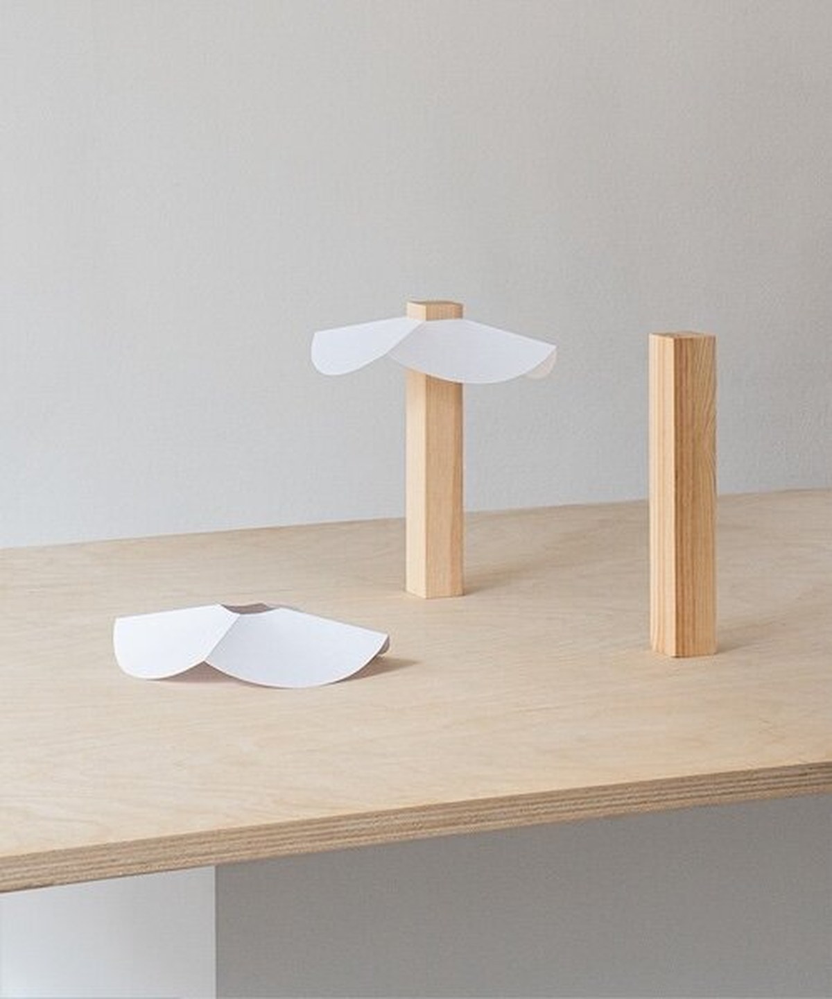 byunggwon na’s ALIT lamp balances ceramic, wood and light in one quiet composition