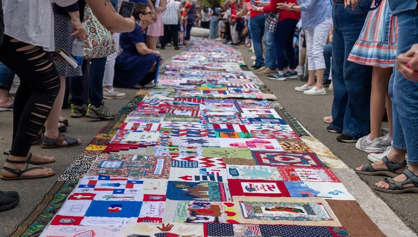 The quilt is a patchwork of American stories.
