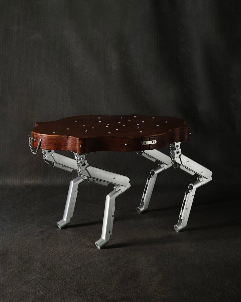 19th-century coffee table gets articulated computer arms to take on a canine form - 2