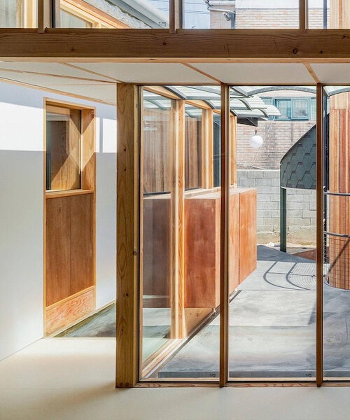 1968 seoul residence is reshaped with courtyard, annex and timber frame