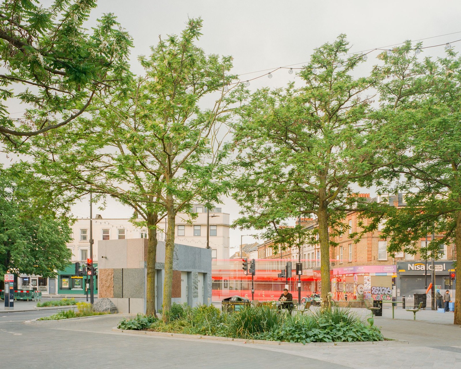 exterior view of Maida Vale public toilet by Studio Weave made out of reclaimed stone, looking like square patchwork
