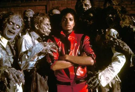 Michael Jackson stands among zombies in the video for Thriller.