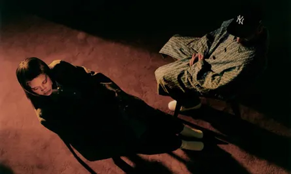 An overhead photo of a man and woman sitting next to each other in the dark