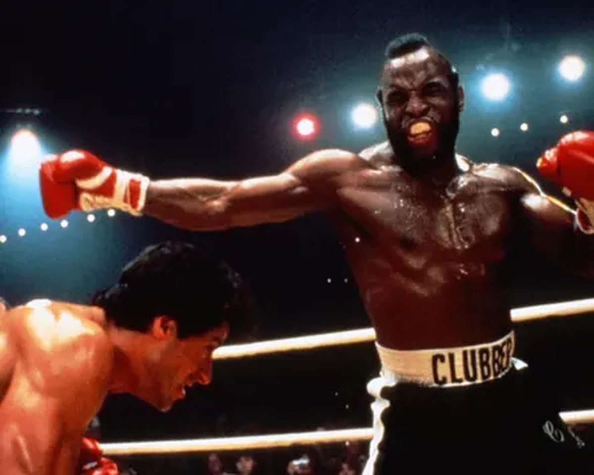 Mr T as Clubber Lang, throwing a punch at Rocky in a boxing ring