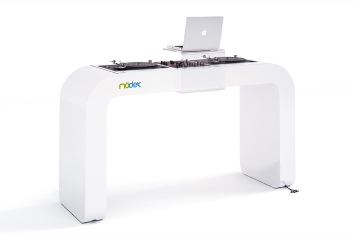 continuous white DJ console integrates turntables, mixers, and hidden cables - 1