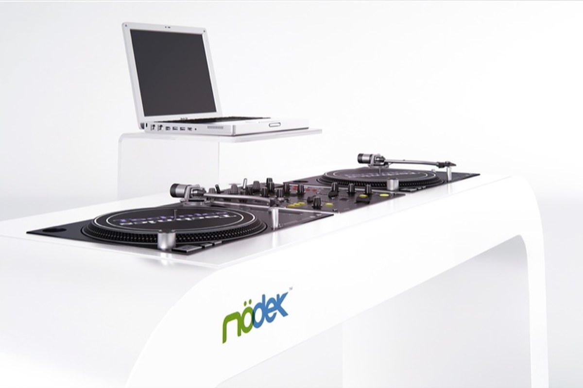 continuous white DJ console integrates turntables, mixers, and hidden cables - 2