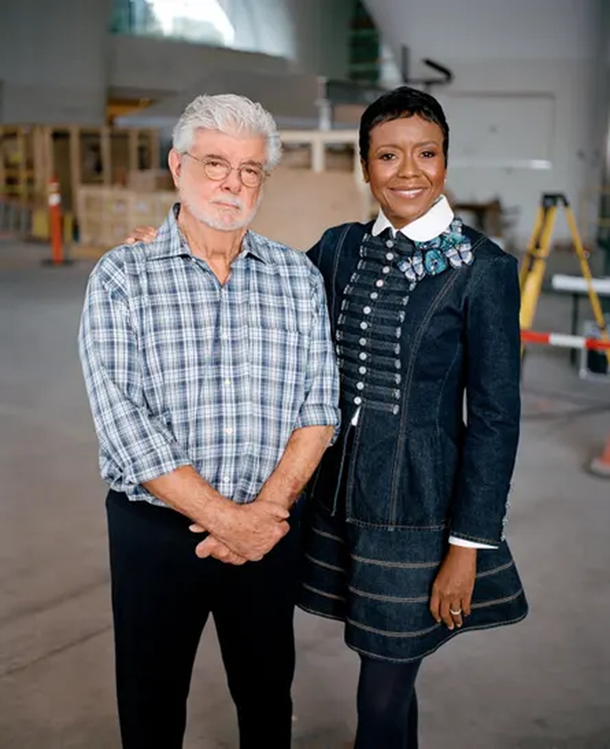a man and woman smiling for the camera
