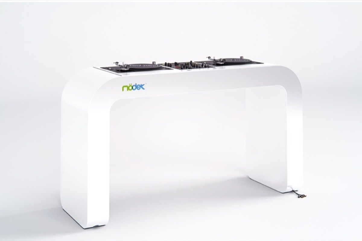 continuous white DJ console integrates turntables, mixers, and hidden cables - 3