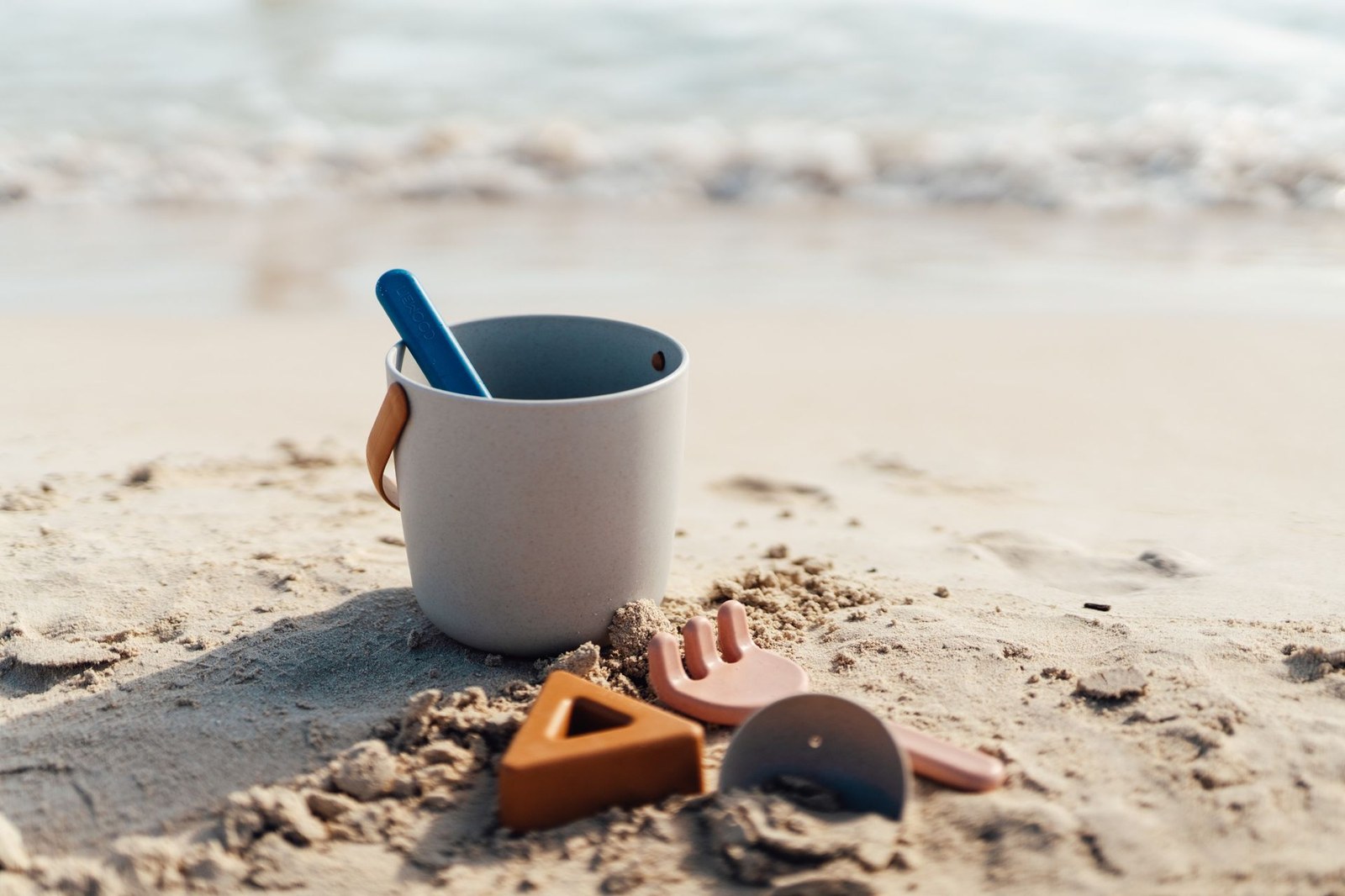 a Bucket and spade on a sandy beach