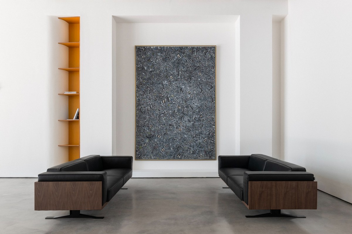 dubai gallery pairs open white exhibition halls with a concealed, brick-toned museum room - 2