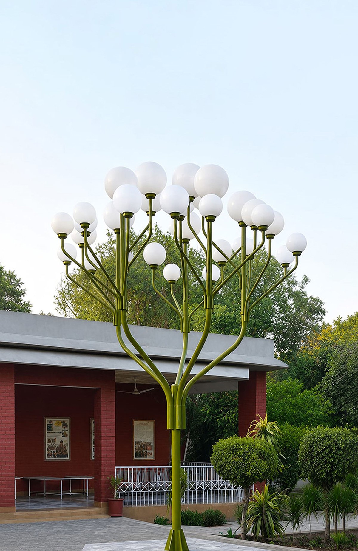 luminous globes extend from branched metal tree installation in pakistan - 2