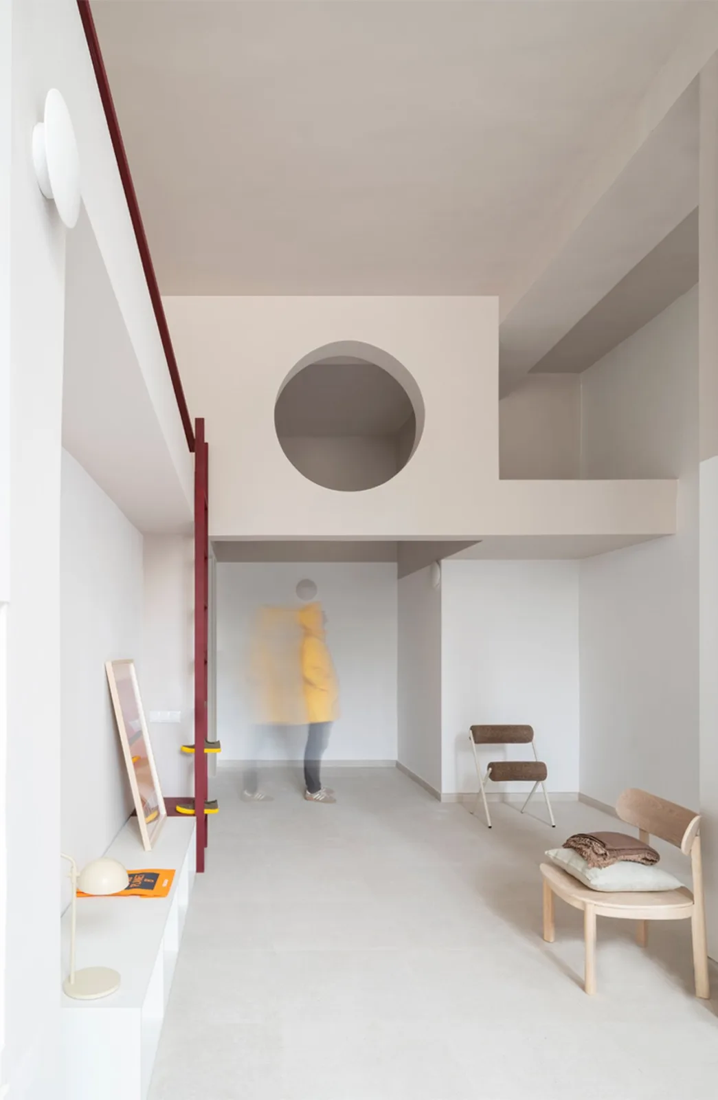 garnet-red accents and high clerestories punctuate AA Apartments in málaga - 2