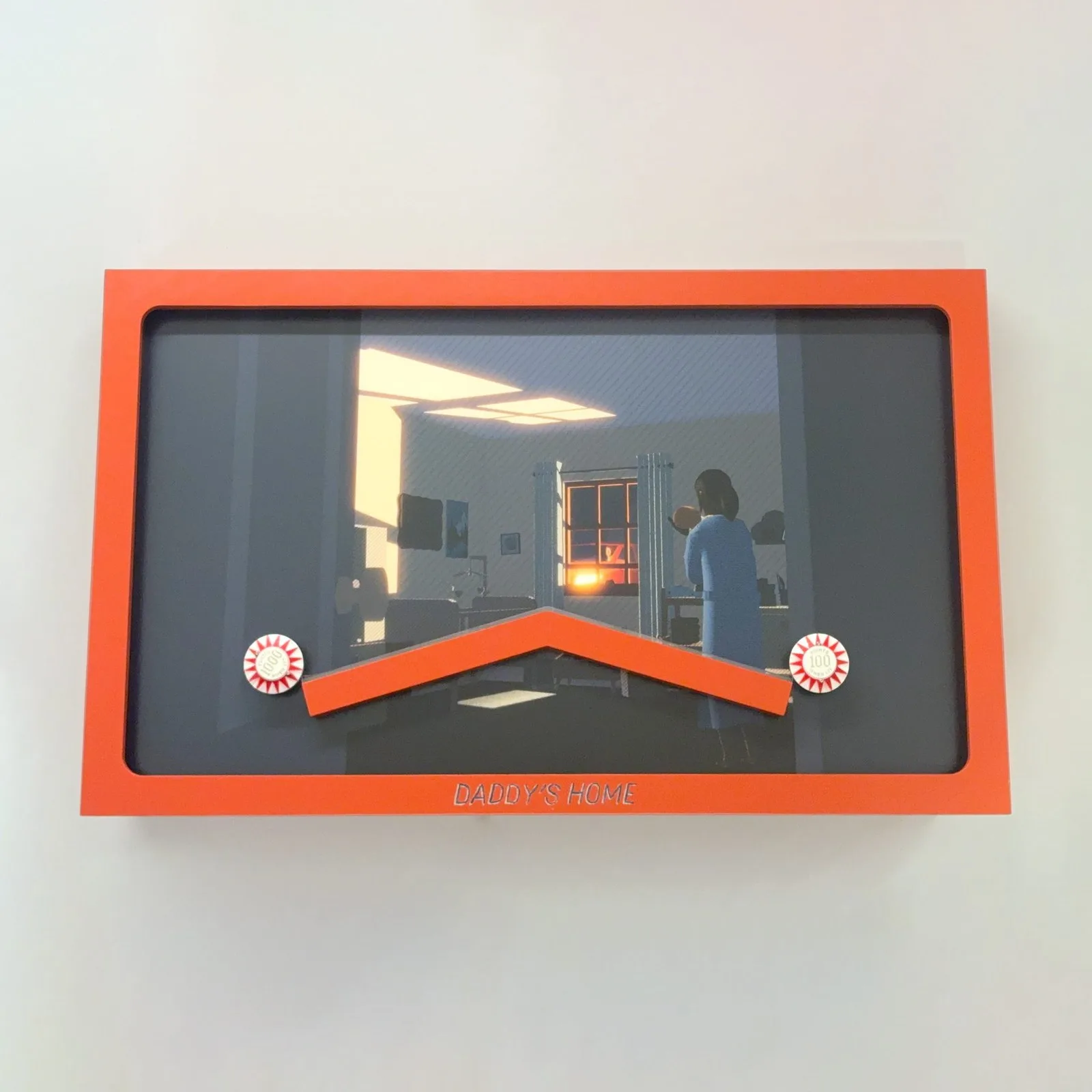 Horizontal wall-mounted shadowbox by Mitchell F. Chan in a bright orange frame with the title “Daddy’s Home” along the bottom. Inside, a dimly lit illustration of a nursery shows a woman in a blue dress with her back to us, holding a baby and looking out a window where an orange glow shines through. An inverted V-shaped orange track sits across the lower half of the scene, with a red-and-white pinball bumper at each end.