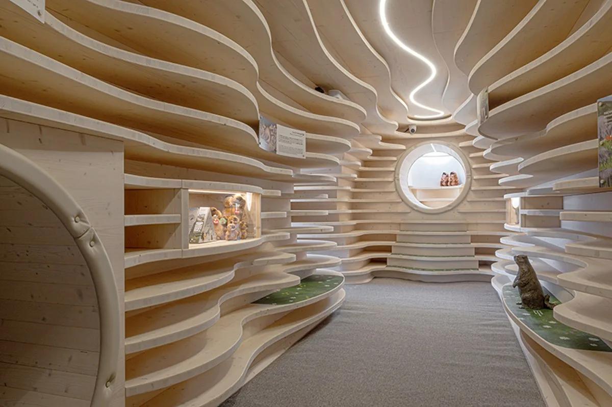 corten steel tubes lined with spruce plywood ribs form alpine learning burrow by officina 82 - 2