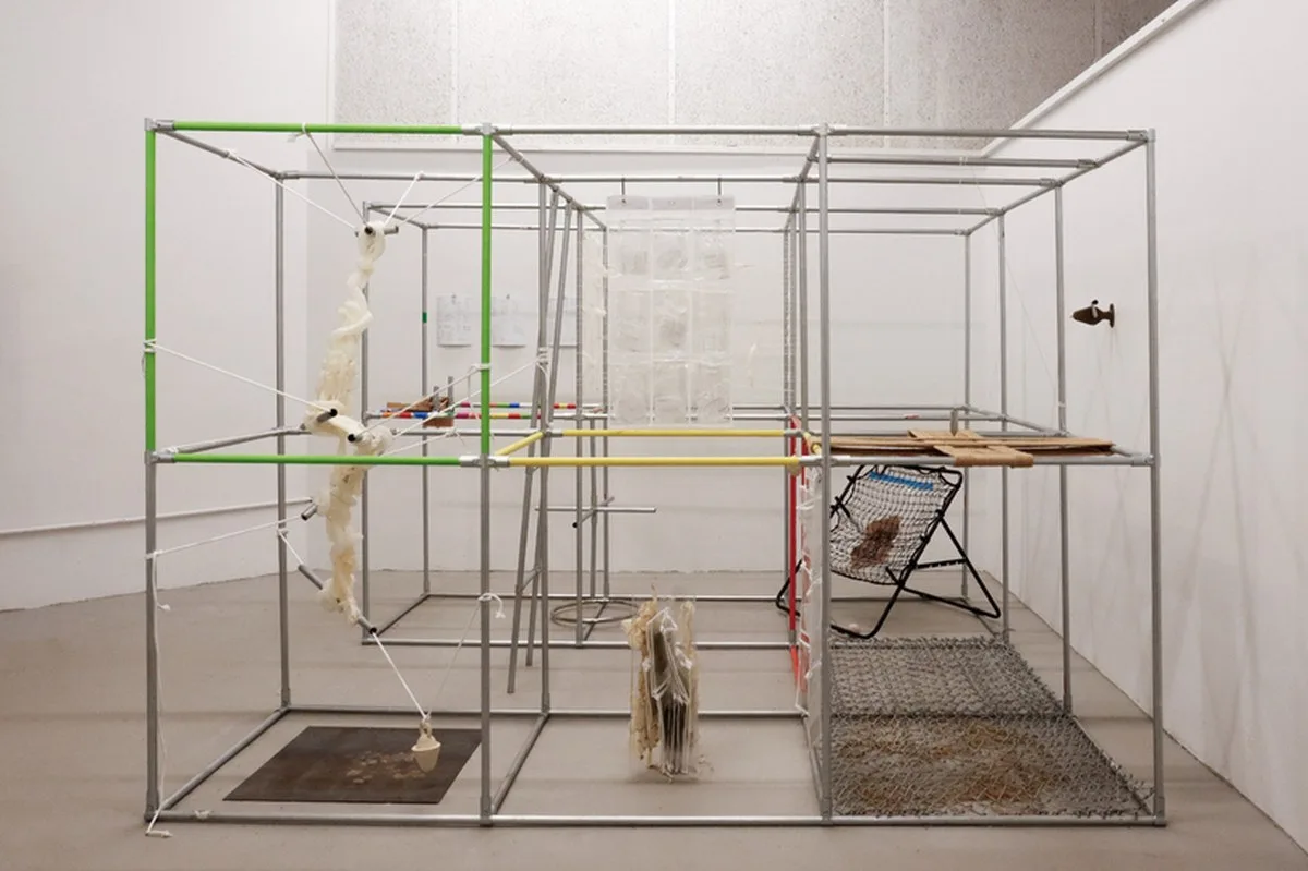 metal pipe grid transforms personal rituals of control into participatory playground - 1