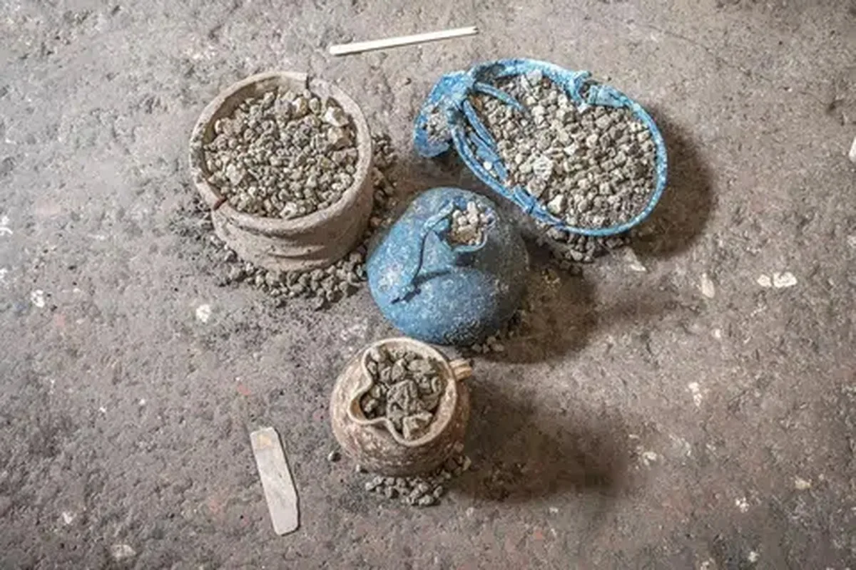 Pottery and other artefacts in the remains of a cupboard uncovered during archaeological excavations in Pompeii, Italy, in this handout image released on October 29, 2026. The cupboard, sealed for nearly 2,000 years, contained household items dating to before the eruption of Mount Vesuvius in A.D. 79. Pompeii Archeological Park/Silvia Vacca/Handout via REUTERS